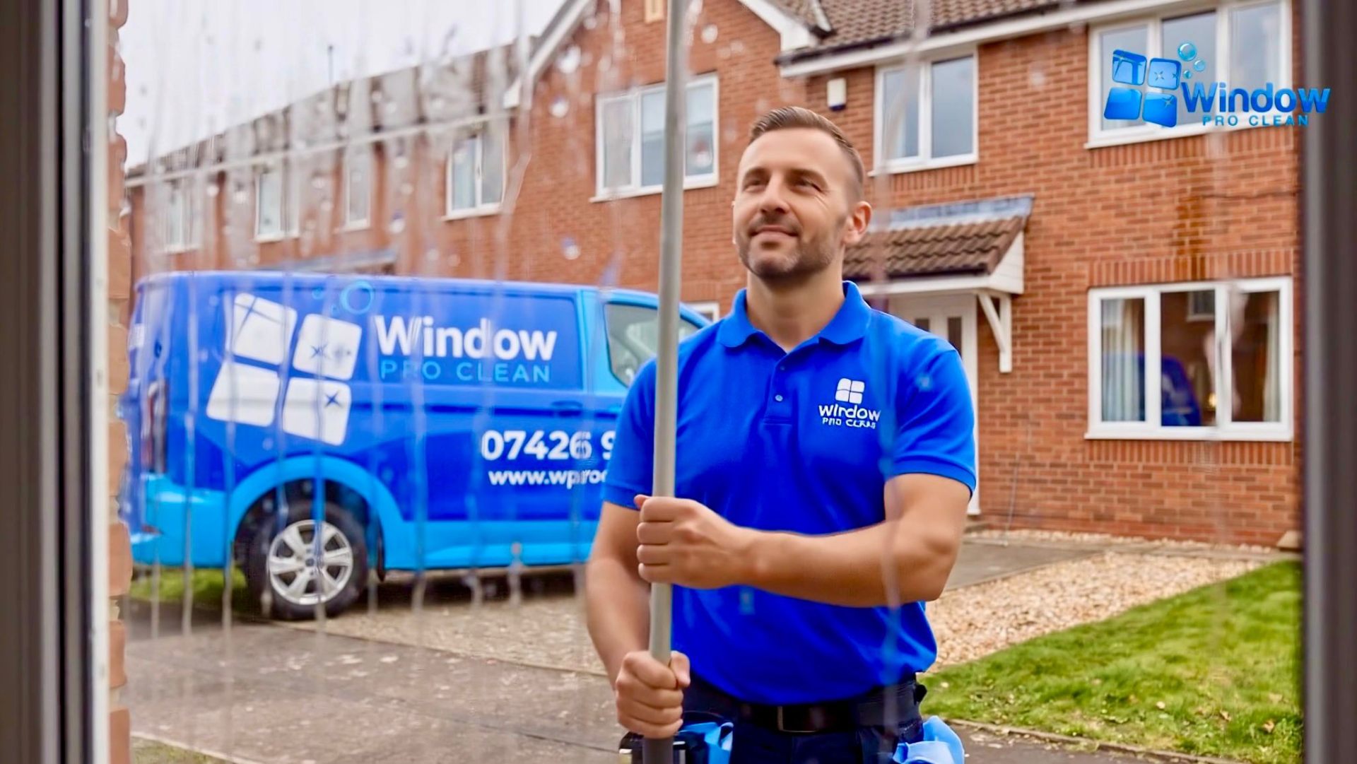 Window Pro Clean technician cleaning a Milton Keynes window streak-free with a pure water system